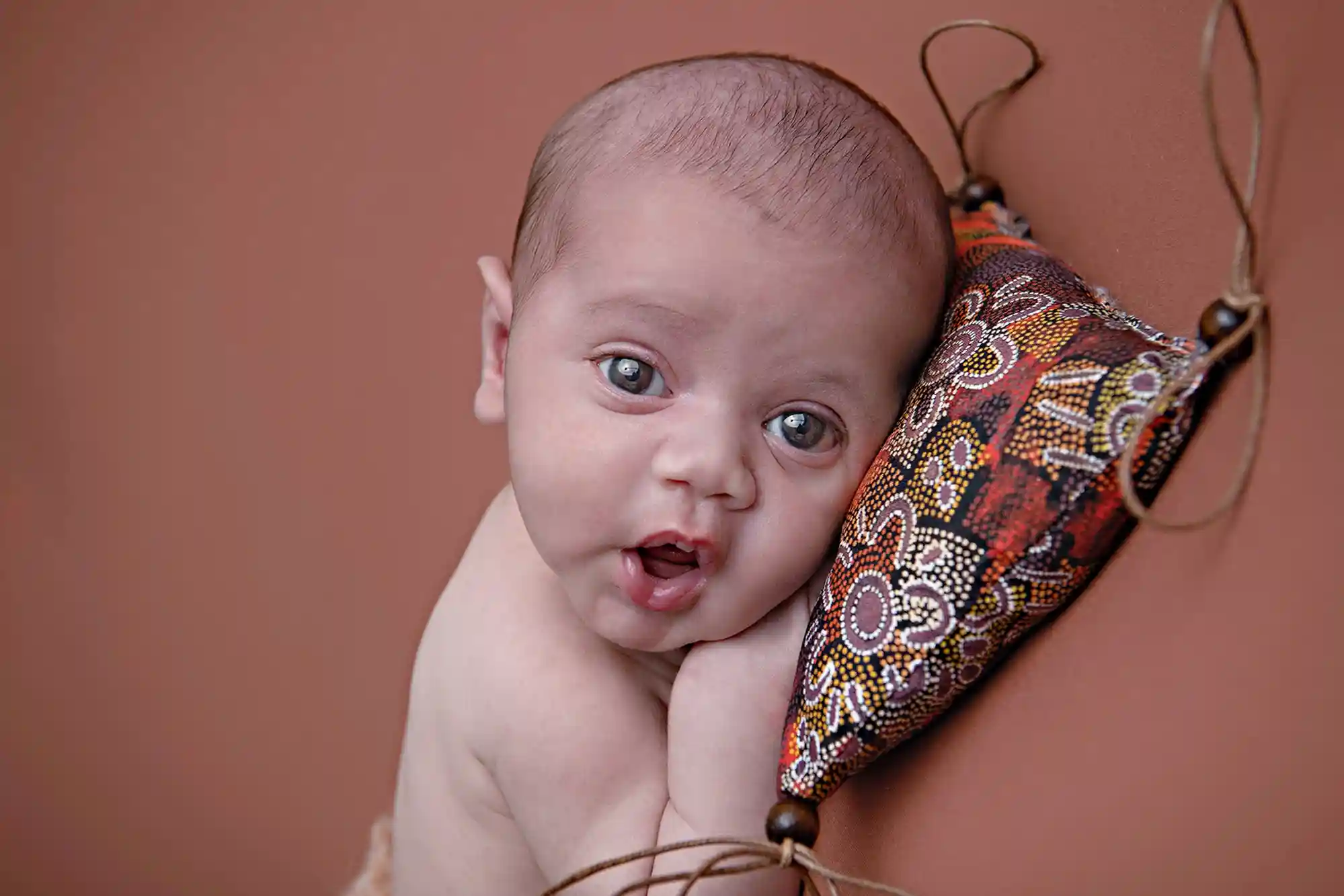Cherubic newborn pose with plush toys at Sky Portraits, Sydney - baby photography